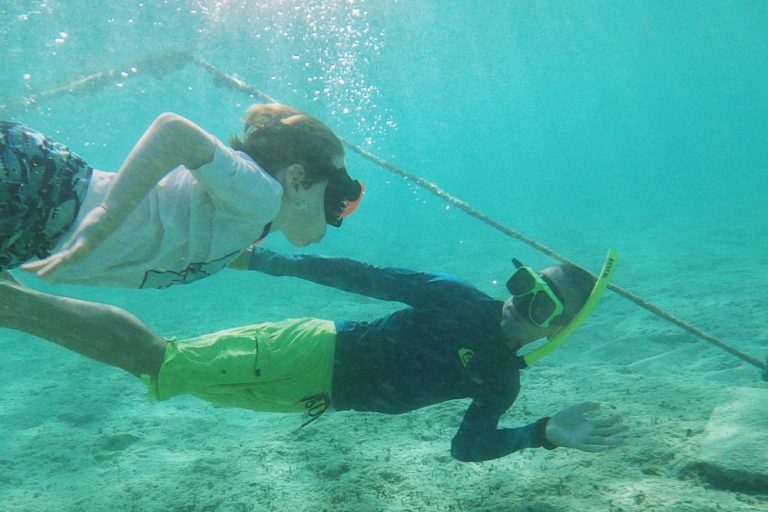 Learning how to dive down when snorkeling in Aruba